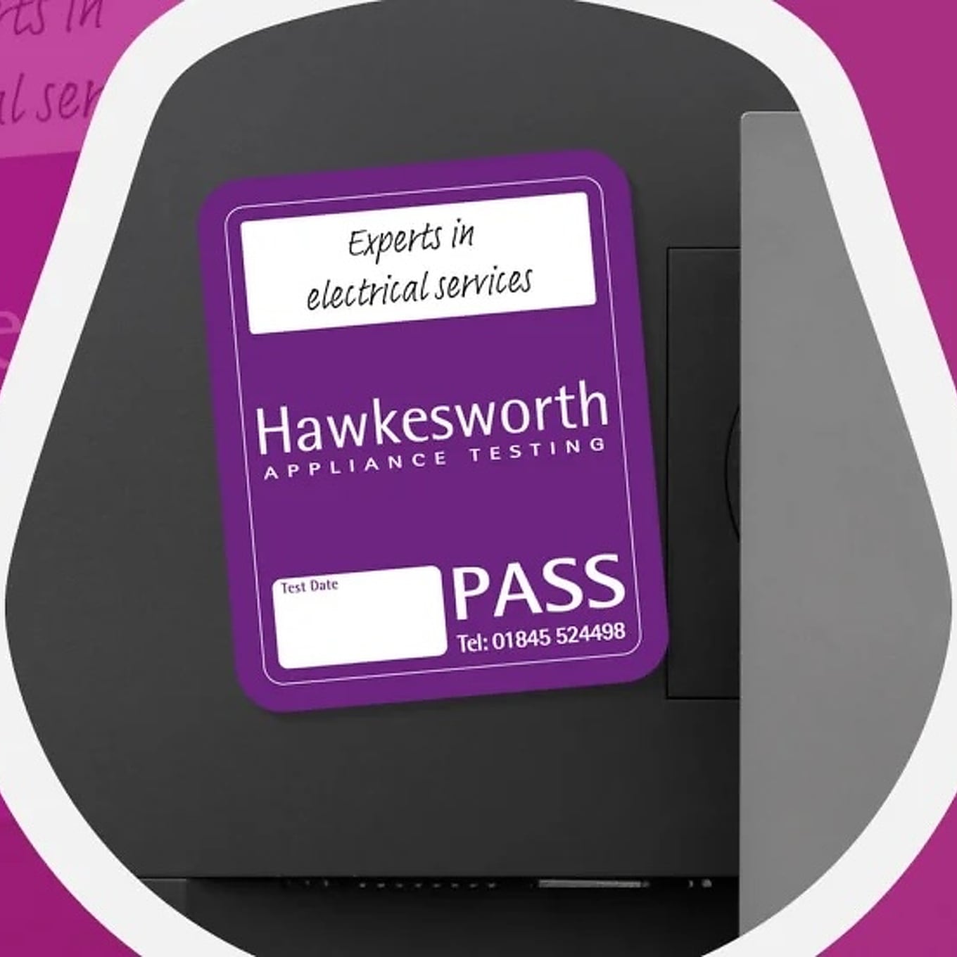 Purple Hawkesworth Appliance Testing pass label attached to electrical equipment.
